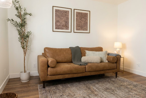 A serene, sunlit therapy room designed for new parents